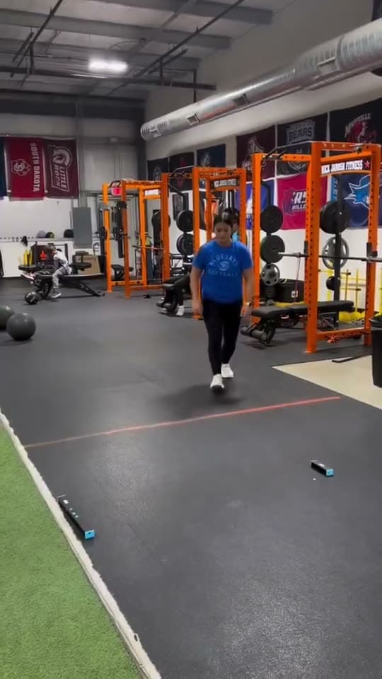 An athlete performs a vertical jump.